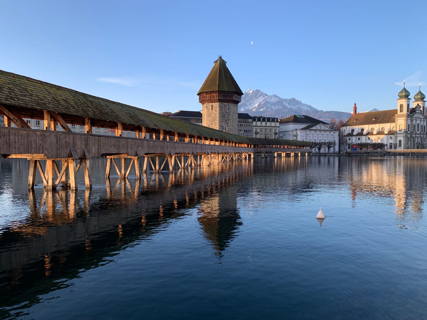 Old town of Lucerne, alleyways and wooden bridge.