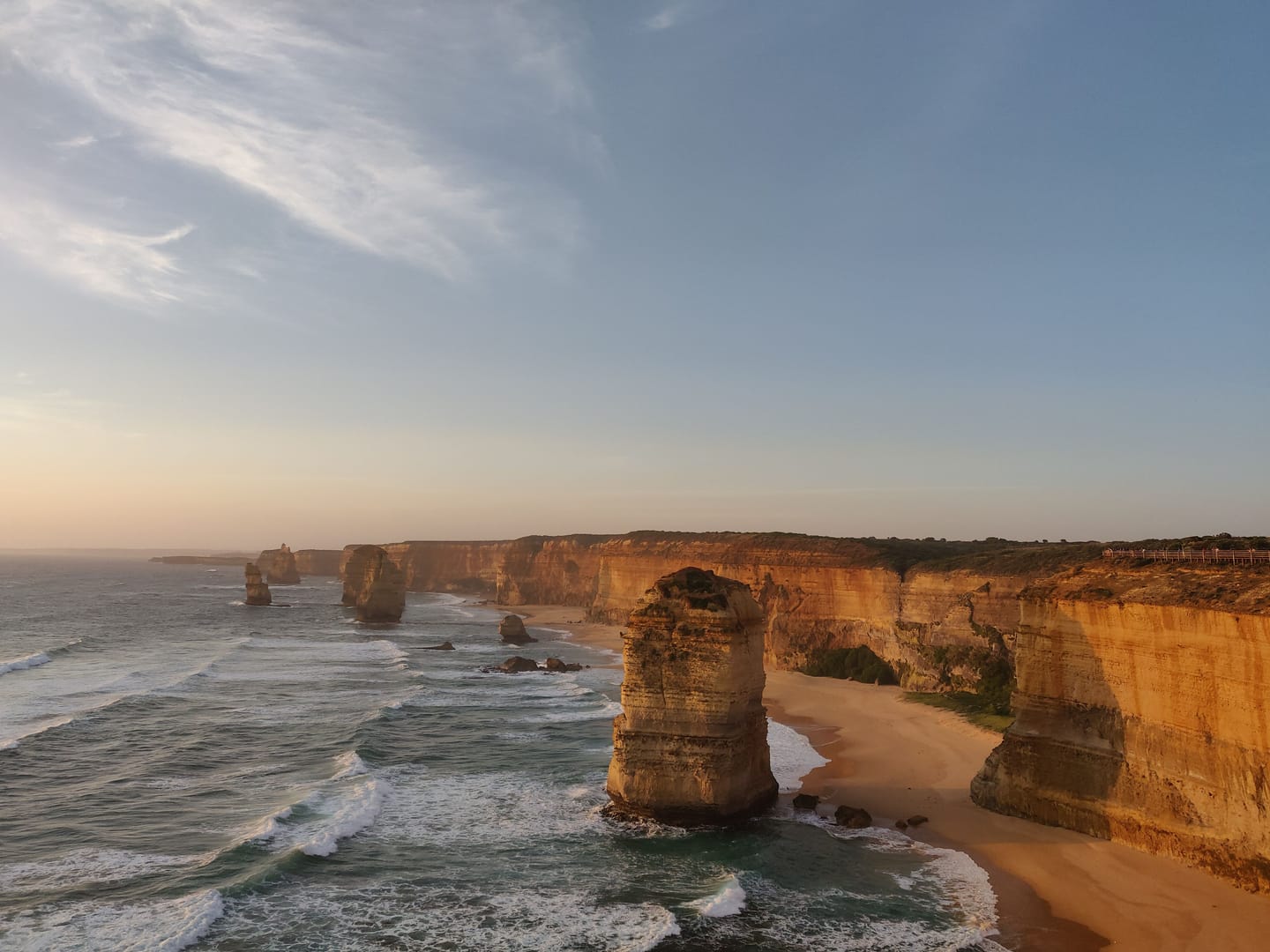 The Twelve Apostles, limestone stacks standing in the ocean.