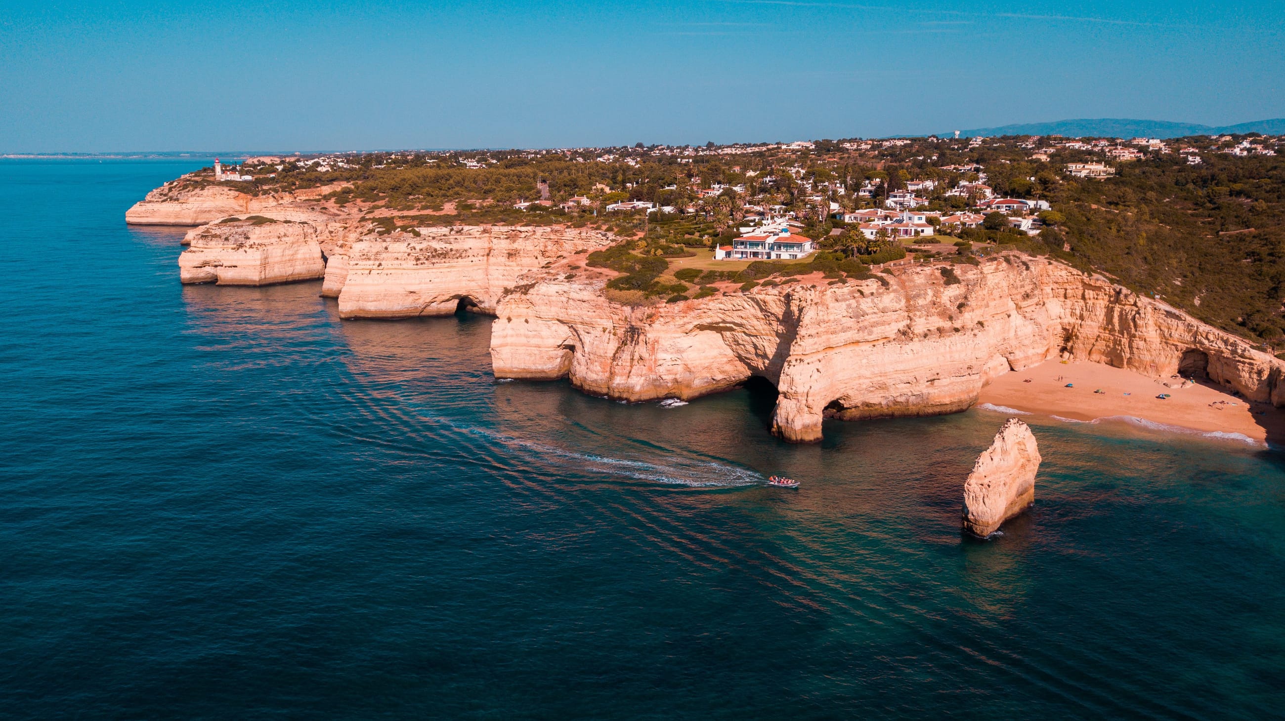 Golden Algarve cliffs above the Atlantic.